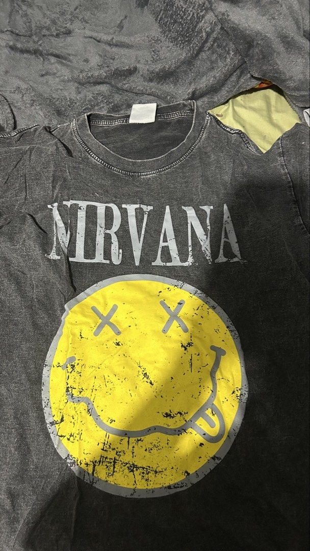 Nirvana Smiley Face Graphic T-Shirt (Category: Tshirts & Polo Shirts ) located in Marikina City. Submitted by chartan15 (Listing ID 1452029491, Image 1). Description: - Grey Nirvana t-shirt - Iconic smiley face graphic - Acid wash style - Made in Thailand - Ideal for any Nirvana fan.