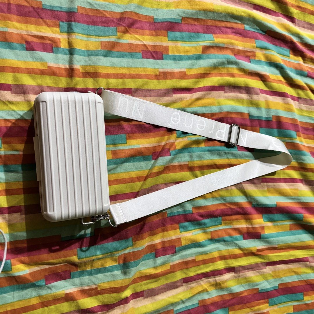 Nuprene Lucca Mini Travel Bag White (Category: Cross-body Bags) located in Makati City. Submitted by jinger_21 (Listing ID 1451915158, Image 2). Description: Slightly used Color white Size small Crossbody Php 1,000 plus shipping fee Payment first before shipout Mode of payment: GoTyme Gcash Maya .