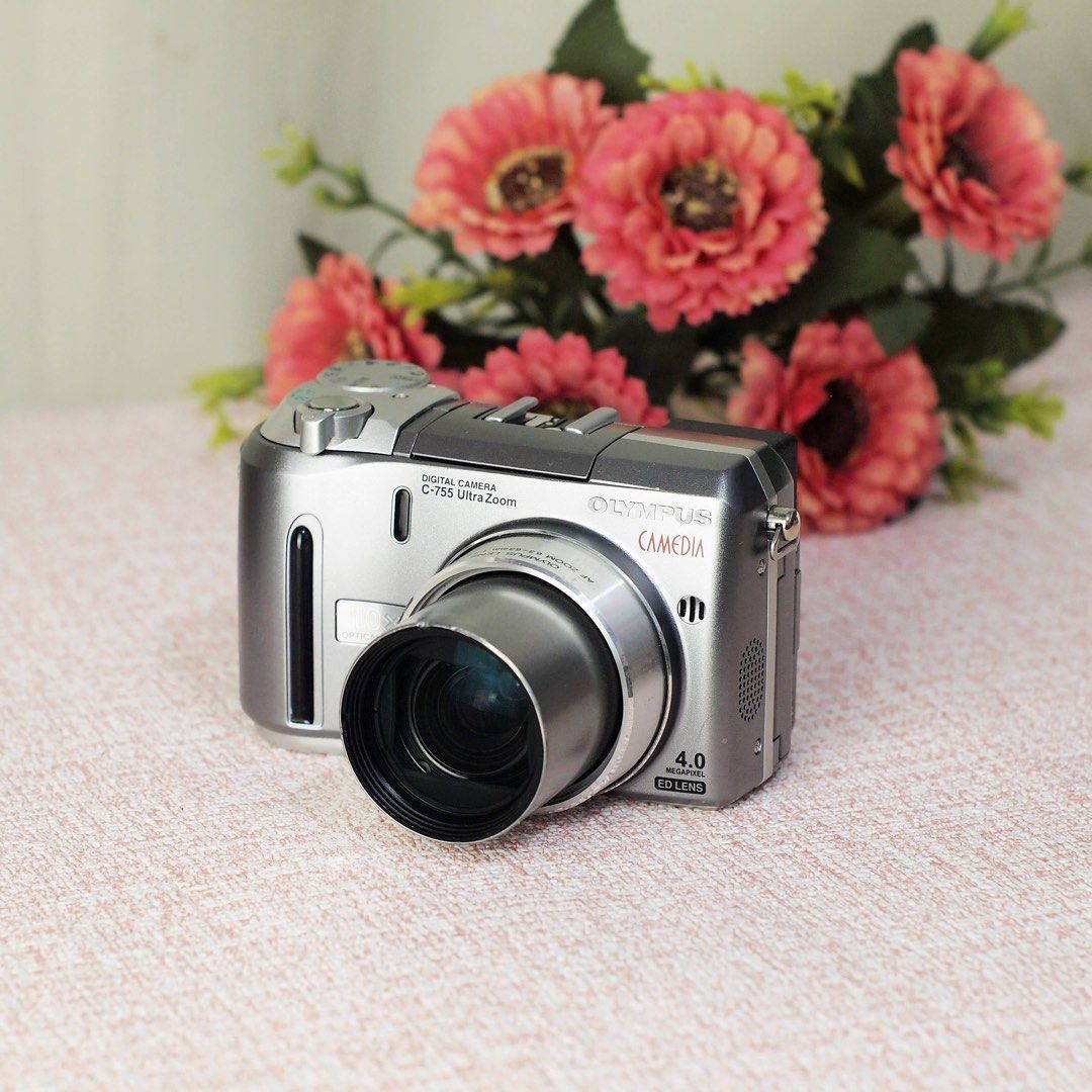 Olympus Camedia C-755 Zoom (Category: Cameras) located in Paranaque City. Submitted by digicamera_zone_ph (Listing ID 1451934581, Image 2). Description: 📸 Olympus CAMEDIA C-755 Ultra Zoom 🔖 3,500 php ✨ Capture timeless memories with the classic Olympus CCD colors! Perfect for collectors, travel, and anyone who loves the vintage digicam aesthetic. ✨ Features: • 4.0MP CCD Sensor • 10× Optical Zoom (38–380mm equivalent) • Super Macro Mode • Manual