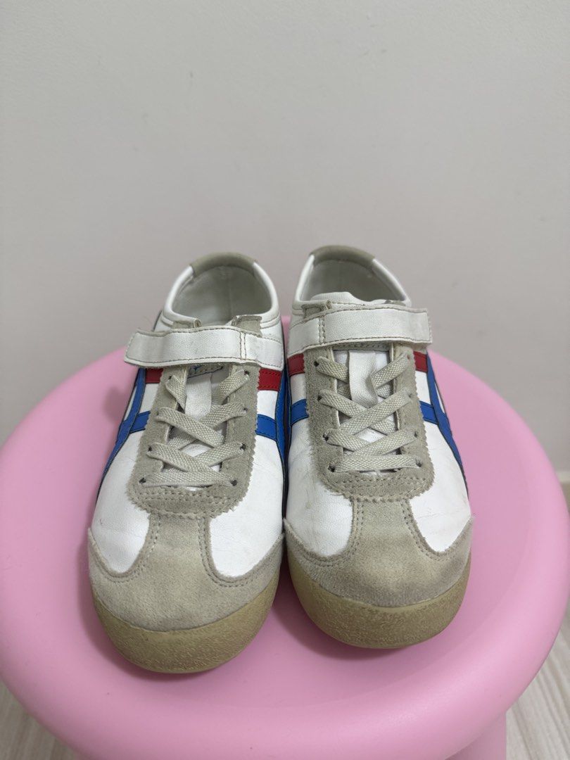 Onitsuka Tiger Mexico 66 Sneaker Kids (Category: Babies & Kids Fashion) located in Pasig City. Submitted by revolveisland (Listing ID 1452033251, Image 2). Description: - Classic Onitsuka Tiger sneakers - White with iconic blue and red stripes - Features convenient velcro straps for easy wear - Soles show some signs of wear but retain good grip - Ideal for everyday use.