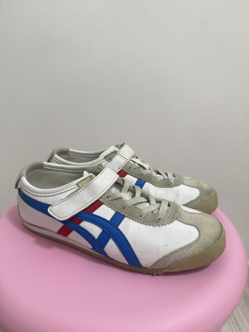 Onitsuka Tiger Mexico 66 Sneaker Kids (Category: Babies & Kids Fashion) located in Pasig City. Submitted by revolveisland (Listing ID 1452033251, Image 1). Description: - Classic Onitsuka Tiger sneakers - White with iconic blue and red stripes - Features convenient velcro straps for easy wear - Soles show some signs of wear but retain good grip - Ideal for everyday use.