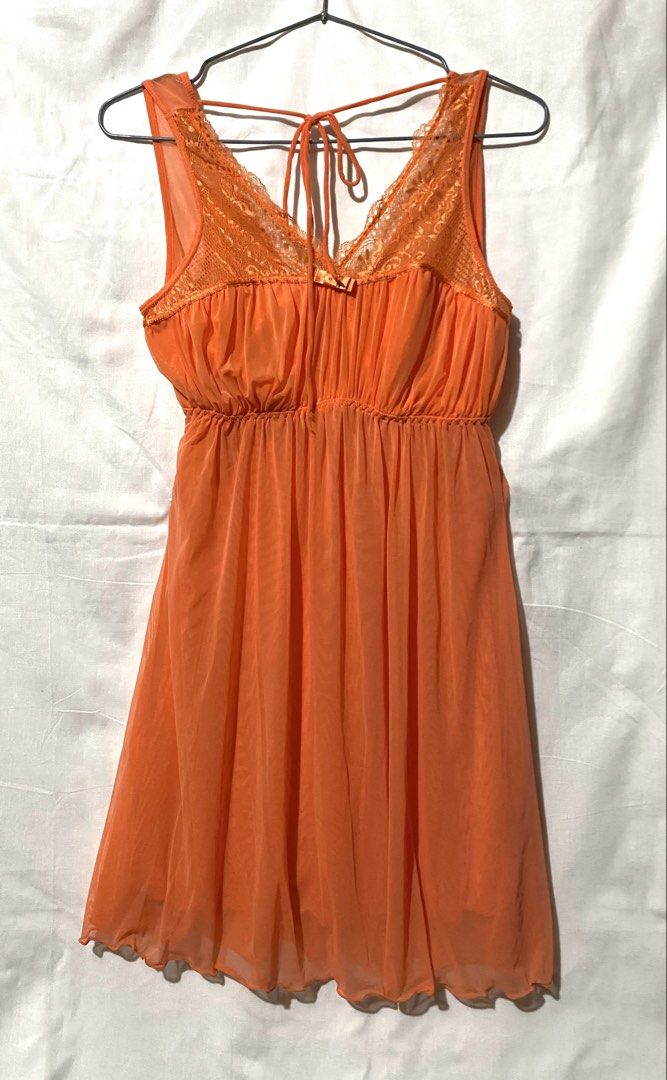 Orange Lace Trim Nightgown with Tie Back (Category: Undergarments & Loungewear) located in Baguio. Submitted by royalriver17 (Listing ID 1452013033, Image 1). Description: Sheer orange nightgown with lace trim, tie-back, and elastic waist. Wavy hem. Lightweight and flowy..
