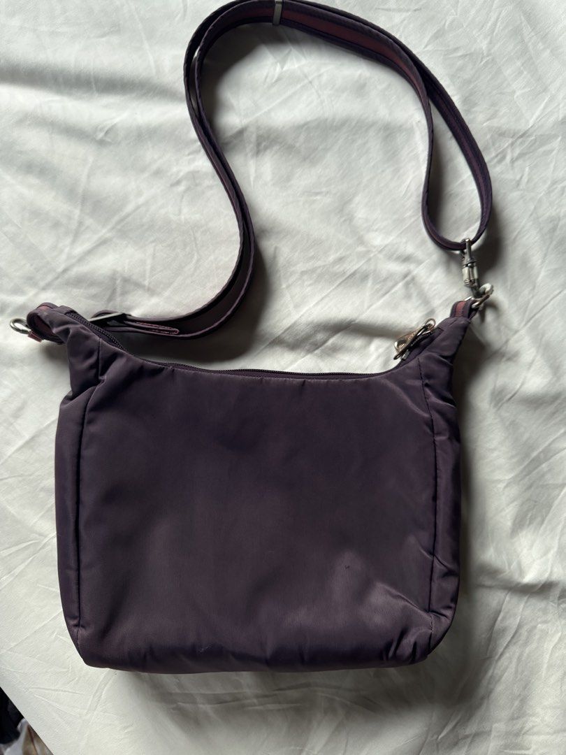 Pacsafe Sling Bag (Category: Shoulder Bags) located in Quezon City. Submitted by Tofulog (Listing ID 1452003693, Image 2). Description: rfs: declutterring issue: faded hardware and stains inside loc: pasong putik, QC.