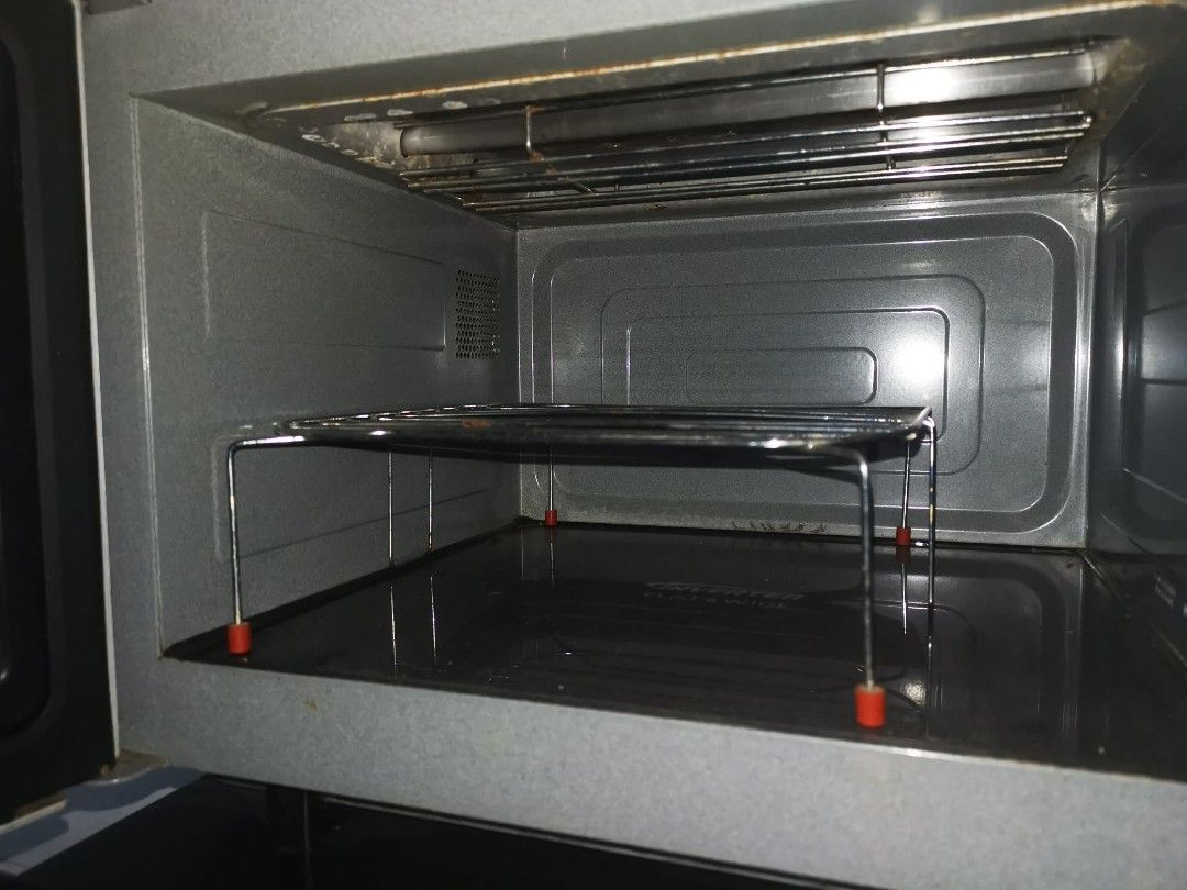 Panasonic Microwave Oven NN-GF569M with Grill Function (Category: Ovens & Toasters) located in Pasig City. Submitted by kyla792980 (Listing ID 1451951873, Image 3). Description: - Panasonic Microwave Oven NN-GF569M - Versatile cooking functions: Auto Reheat, Grill, Steam Fish, Roast Chicken - Convenient features: Recipe Store, Turbo Defrost - Includes wire rack for grilling - Ideal for quick meals and efficient cooking.