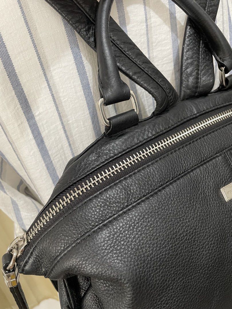 SUPER SALE! Patrice Bréal Black Genuine Leather Backpack (Category: Backpacks) located in Cabanatuan. Submitted by moraiahraven (Listing ID 1452105451, Image 3). Description: Authentic Patrice Bréal black pebbled leather backpack (can also be carried by the top handle). Features: • Soft, textured black leather exterior • Silver-tone hardware throughout • Top zipper closure + dual front zippered compartments • Adjustable backpack straps • Top carr