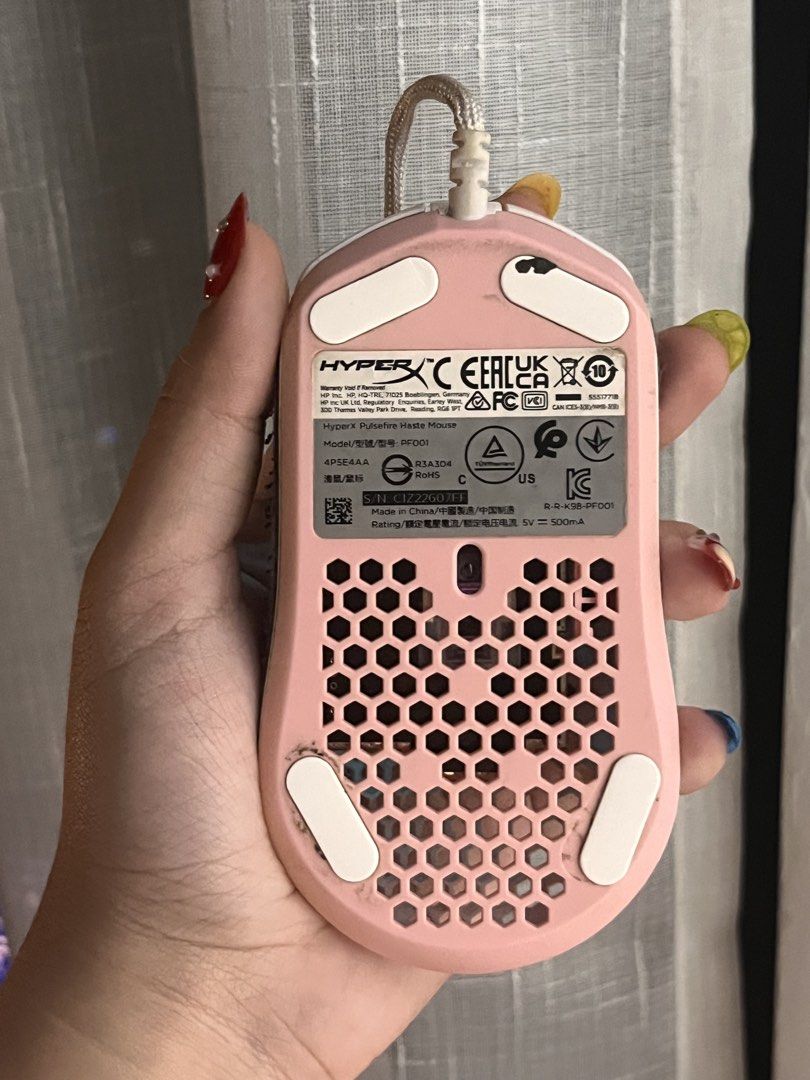 (Pink & White) HyperX Pulsefire Haste Gaming Mouse White Pink (Category: Mouse & Mousepads) located in Makati City. Submitted by belladonna.ph_ (Listing ID 1452053736, Image 3). Description: White & pink 🩷🎀 HyperX Pulsefire Haste gaming mouse! Lightweight honeycomb design, RGB scroll wheel. Minor signs of wear, works perfectly. The black thing on it is grip pad provided by HyperX, comes with the mouse. Will be removed and cleaned upon request. 