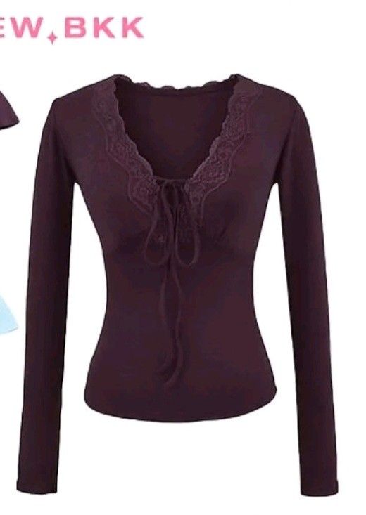 Plum Lace Trim Tie-Front Long Sleeve Top (Category: Longsleeves) located in Manila. Submitted by monaaa03 (Listing ID 1452019221, Image 1). Description: - Never worn -Cute plum colored long sleeve top - Features delicate lace trim along the neckline - Stylish tie-front detail - Fitted silhouette for a flattering look - Versatile for layering or wearing solo.