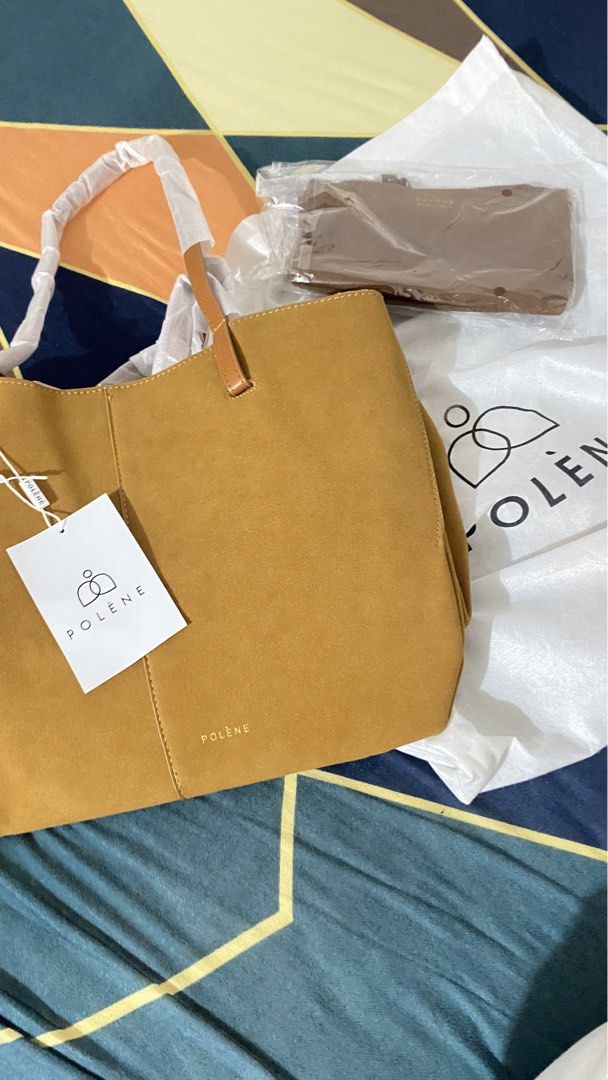 Polene Tote Bag with Pouch (Category: Luxury Bags & Wallets) located in Davao. Submitted by akushhla (Listing ID 1452034646, Image 1). Description: - Brand: Polene - Material: Brown Suede - Style: Tote Bag - Includes: Matching Pouch, Original Dust Bag - Condition: Great everyday bag, selling as it's not being used..