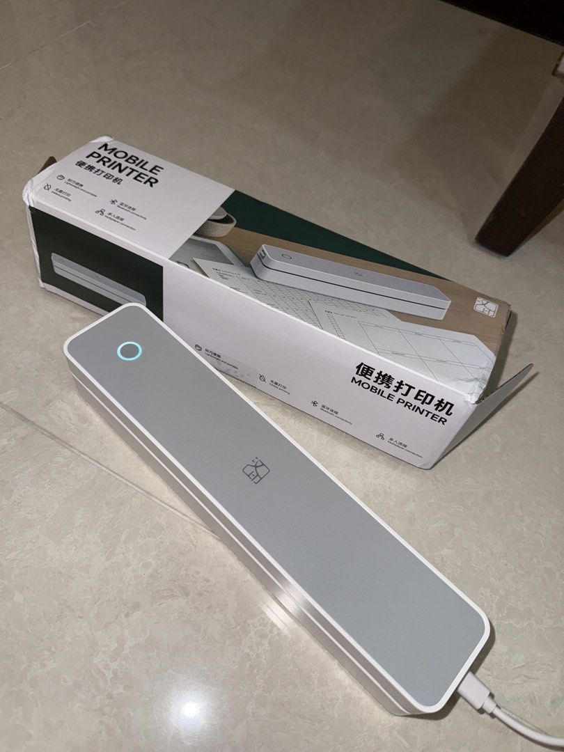 Portable Mobile Printer - Thermal wireless printer (Category: Printers, Scanners & Copiers) located in Singapore. Submitted by _axolotl (Listing ID 1452048607, Image 1). Description: - Compact and portable for printing on the go - Thermal wireless printing - Simple USB-C connectivity - User-friendly operation - Includes original box - Perfect for mobile printing needs Bought New. Used twice only, once for testing. Letting go as it doesn’t fit my 