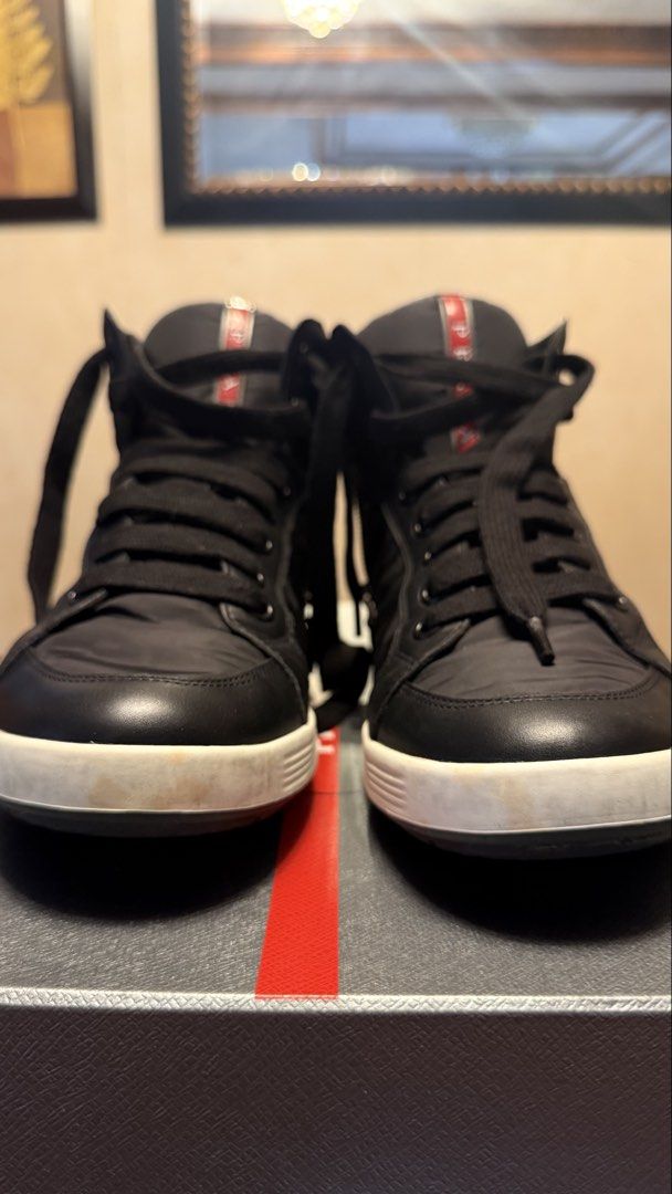 Prada High Cut Sneakes (Category: Sneakers & Footwear) located in Muntinlupa City. Submitted by tys_stuff (Listing ID 1451983476, Image 2). Description: Prada Highcut Sneakers Originally Bought in Japan (pre pandemic), sole has some discoloration as seen in the pictures. Size 7.5 .