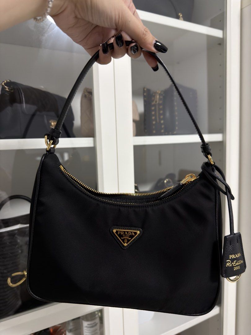 Prada Re-Edition 2005 Nylon Shoulder Bag Black (Category: Luxury Bags & Wallets) located in Manila. Submitted by marj_yyy (Listing ID 1452025011, Image 1). Description: - Authentic from Prada Greenbelt - With receipt - Complete with box, dust bag, and paper bag - RFS: wants to buy a new bag 😂 - Rarely used .