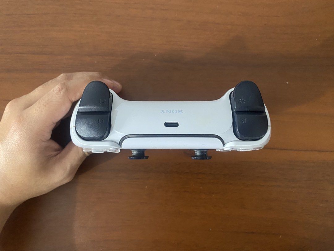 PS5 CONTROLLER (Category: Controllers) located in Santa Rosa. Submitted by jiminloi (Listing ID 1452047763, Image 2). Description: PS5 CONTROLLER FOR SALE!!! ₱2,500 ONLY!! -LINISIN NIYO NA LANG YUNG LIKOD DAHIL DUN SA PINK COVER NA GOMA -NEW BATTERY BIÑAN LAGUNA LOCATION .