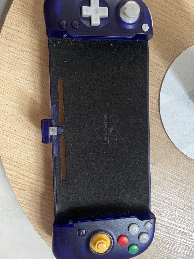 RETROFLAG Gampad for Switch (Category: Controllers) located in Quezon City. Submitted by mattyu22 (Listing ID 1451901958, Image 1). Description: - Retro gaming grip designed for Nintendo Switch - Transluscent purple color. - Issue: Rubber padding became too brittle so it came off on its own.