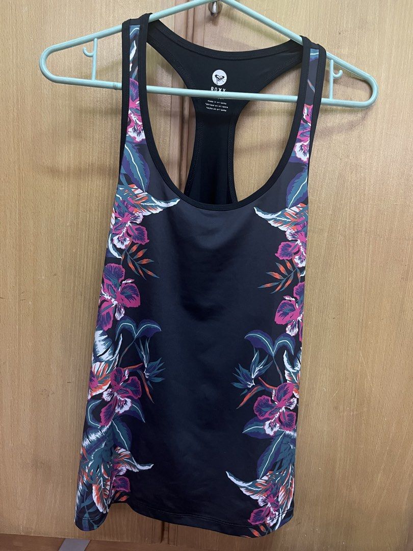 Roxy Black Floral Racerback Tank Top Size S (Category: Sleeveless) located in Manila. Submitted by cccuyyy (Listing ID 1451949807, Image 1). Description: - Roxy tank top - Black base with vibrant floral print on sides - Racerback design - Made in Sri Lanka - Size S - Ideal for workouts or casual wear.
