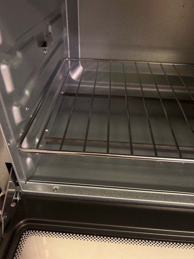 Sharp Oven (Category: Ovens & Toasters) located in Singapore. Submitted by sparkingjoy.reducereuserecycle (Listing ID 1452033052, Image 2). Description: - Sharp oven with sleek black exterior - Multiple function settings - Temperature control up to 230°C - Built-in timer function - Perfect for baking and roasting needs.