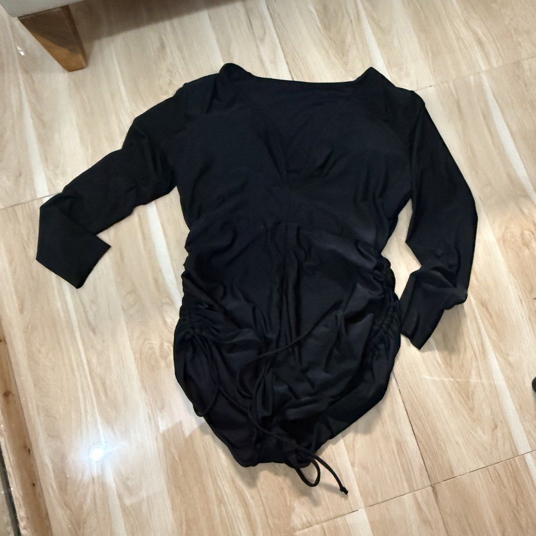 SHEIN Black Long Sleeve Ruched Swimsuit (Category: Bikinis & Swimsuits) located in Quezon City. Submitted by _seyer (Listing ID 1451973095, Image 2). Description: - Black long-sleeved one-piece swimsuit - Plunging neckline - Ruched sides with adjustable drawstring ties - Built-in bust padding - Ideal for swimming and beach days - Comfortable and stylish.
