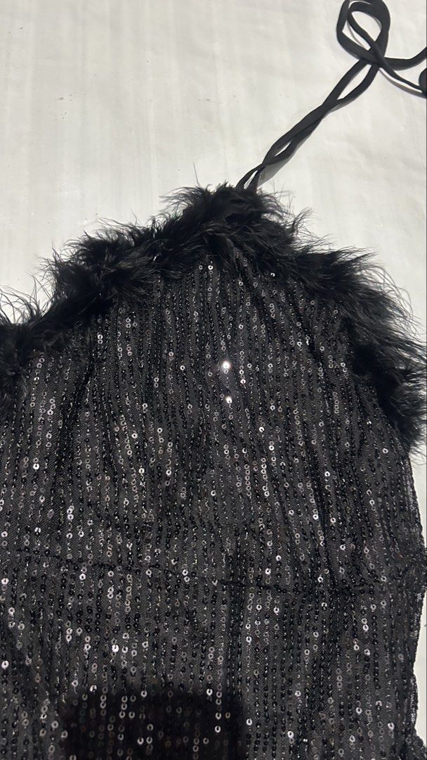 Shein Black Sequin Halter Top with Feather Trim (Category: Sleeveless) located in Marikina City. Submitted by chartan15 (Listing ID 1452009704, Image 1). Description: - Sparkly black halter top - Covered in sequins - Fun feather trim around the neckline - Ties at the back of the neck - Ideal for a night out or party - Very eye-catching and makes you stand out.