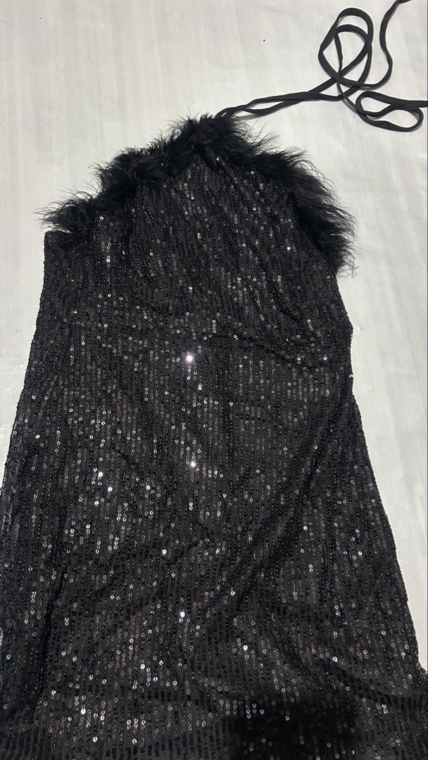 Shein Black Sequin Halter Top with Feather Trim (Category: Sleeveless) located in Marikina City. Submitted by chartan15 (Listing ID 1452009704, Image 2). Description: - Sparkly black halter top - Covered in sequins - Fun feather trim around the neckline - Ties at the back of the neck - Ideal for a night out or party - Very eye-catching and makes you stand out.