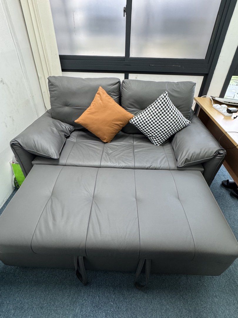 Sofa bed (Category: Sofas) located in Singapore. Submitted by winnielau39 (Listing ID 1452079595, Image 2). Description: Freemax Gray Sofa Bed As good as new condition! -Super underused as it has always been in the spare room. Sits 2 pax and converts into a spacious single bed -Easily converts into a chaise lounge or a flat bed. Tufted cushions for comfort. -Compact design, great for small spaces. Perfect for guests or lounging. Sturdy build with
