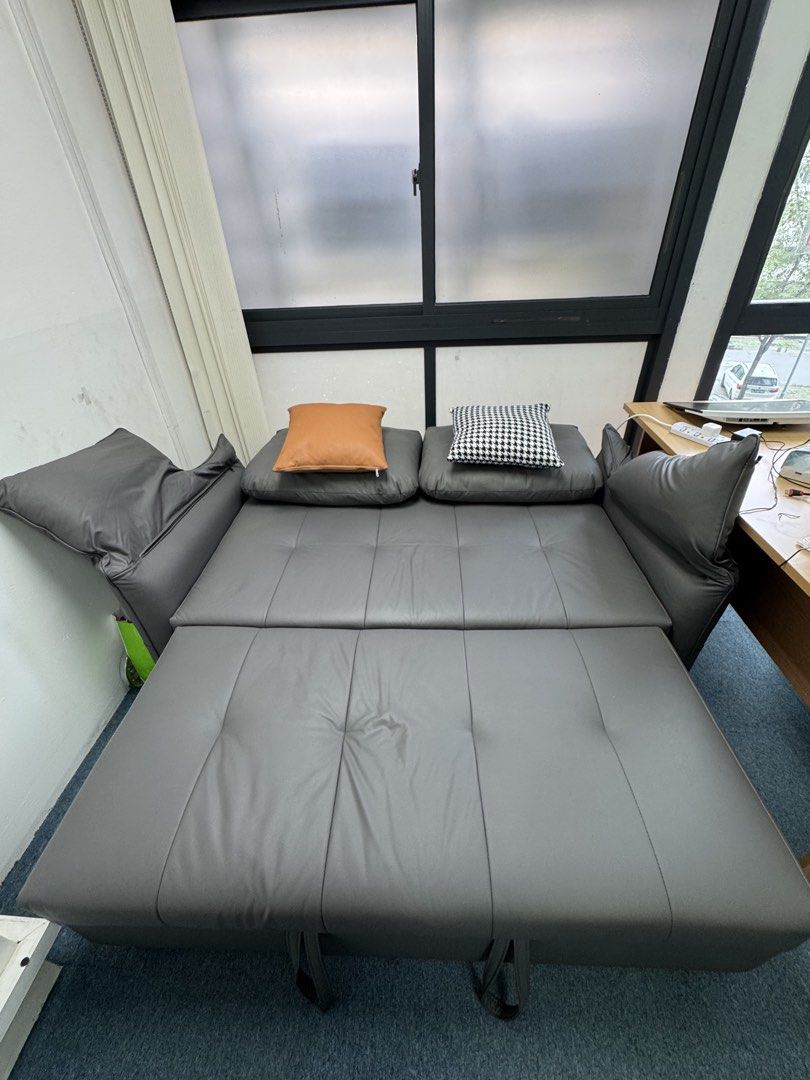 Sofa bed (Category: Sofas) located in Singapore. Submitted by winnielau39 (Listing ID 1452079595, Image 3). Description: Freemax Gray Sofa Bed As good as new condition! -Super underused as it has always been in the spare room. Sits 2 pax and converts into a spacious single bed -Easily converts into a chaise lounge or a flat bed. Tufted cushions for comfort. -Compact design, great for small spaces. Perfect for guests or lounging. Sturdy build with