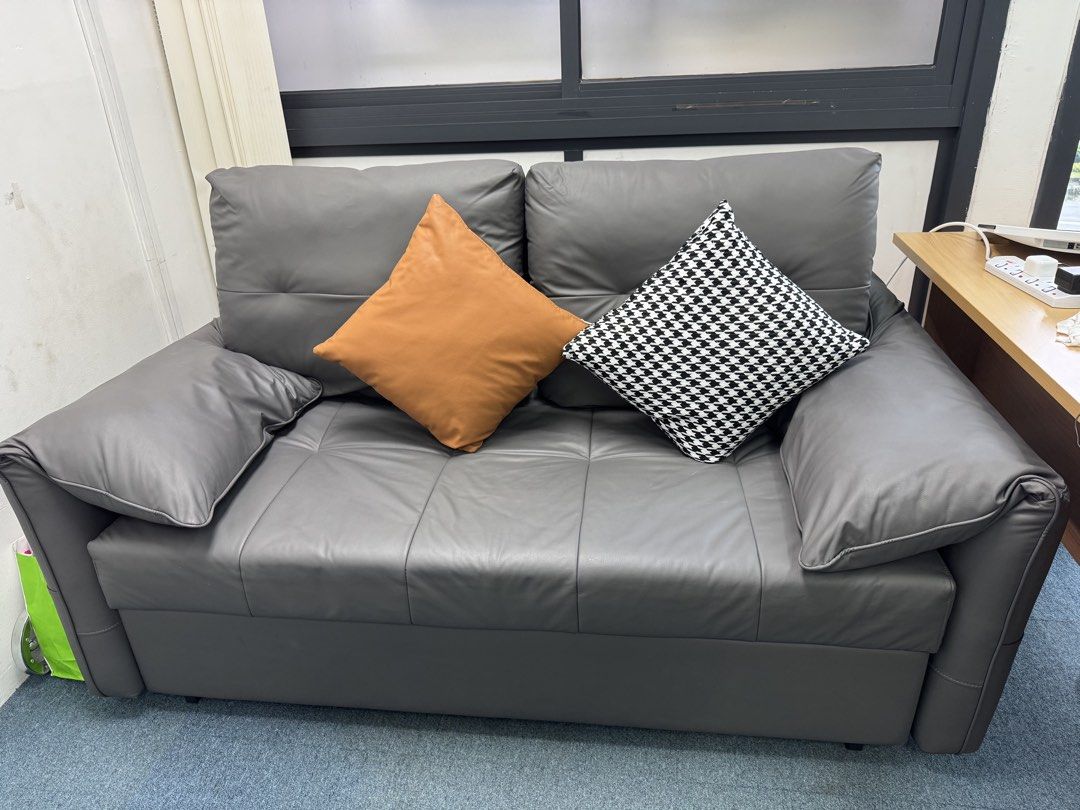 Sofa bed (Category: Sofas) located in Singapore. Submitted by winnielau39 (Listing ID 1452079595, Image 1). Description: Freemax Gray Sofa Bed As good as new condition! -Super underused as it has always been in the spare room. Sits 2 pax and converts into a spacious single bed -Easily converts into a chaise lounge or a flat bed. Tufted cushions for comfort. -Compact design, great for small spaces. Perfect for guests or lounging. Sturdy build with