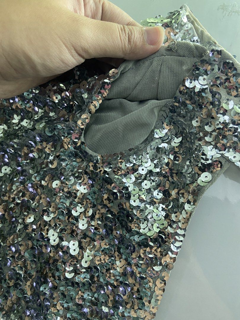 Sparkly Sequin Party top (Category: Dresses) located in Manila. Submitted by khaleesi_bkk2 (Listing ID 1451955803, Image 3). Description: - Eye-catching shiny sequin embellishments all over. - Flattering short sleeves. - Fun flared skirt for a playful silhouette. - Fabric has a comfortable stretch. - Ideal for parties, celebrations, and special events. - Designed to beautifully catch and reflect light..