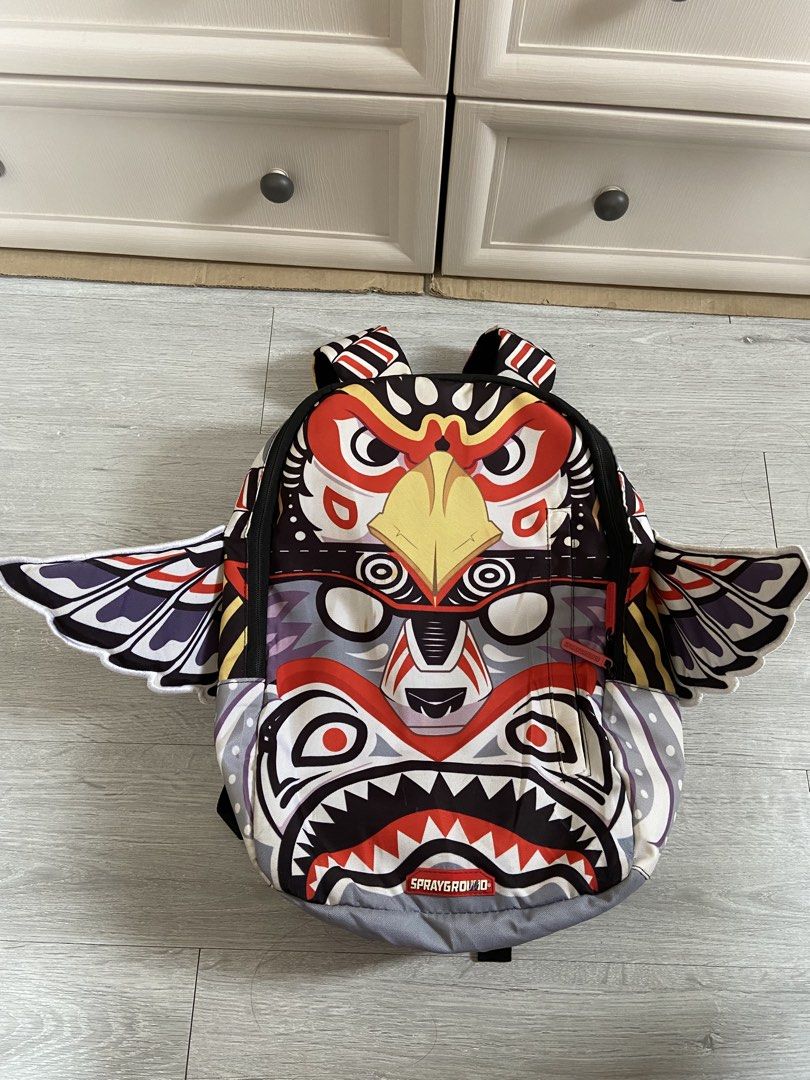 Sprayground Backpack - Tribal Eagle Shark Design (Category: Backpacks) located in Binan City. Submitted by doze16 (Listing ID 1452044092, Image 1). Description: - Unique Sprayground backpack - Features a striking tribal eagle and shark design - Distinctive wing details on the sides - Padded straps for maximum comfort - Ideal for school, travel, or everyday adventures - Clearly displays the Sprayground logo.