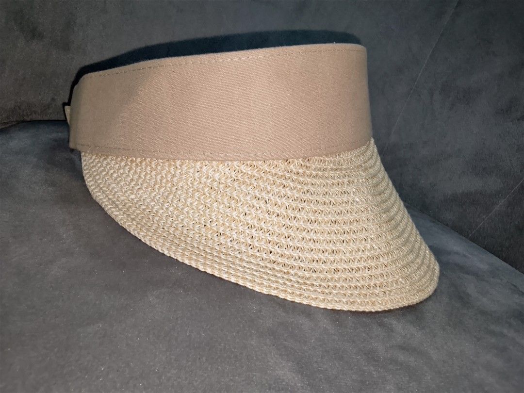 Straw Visor Hat with Tan Fabric Band (Category: Hats & Beanies) located in Binangonan. Submitted by yuristalin888 (Listing ID 1452083710, Image 2). Description: - Lightweight straw visor - Tan fabric band around the crown - Provides excellent sun protection for your face - Comfortable to wear - Easy to pack for travel - Ideal for beach days or casual outings.