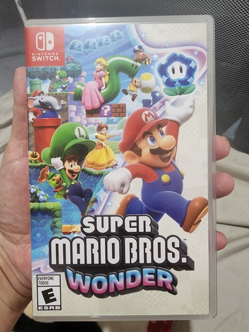 Super Mario Bros. Wonder Nintendo Switch Game (Category: Nintendo) located in Caloocan City. Submitted by erreiv (Listing ID 1452103330, Image 1). Description: - Super Mario Bros. Wonder for Nintendo Switch - Play as Mario, Luigi, Peach, and Daisy - Explore exciting new worlds - Collect Wonder Flowers for surprising transformations - Utilize new power-ups and abilities - Fun for the whole family.