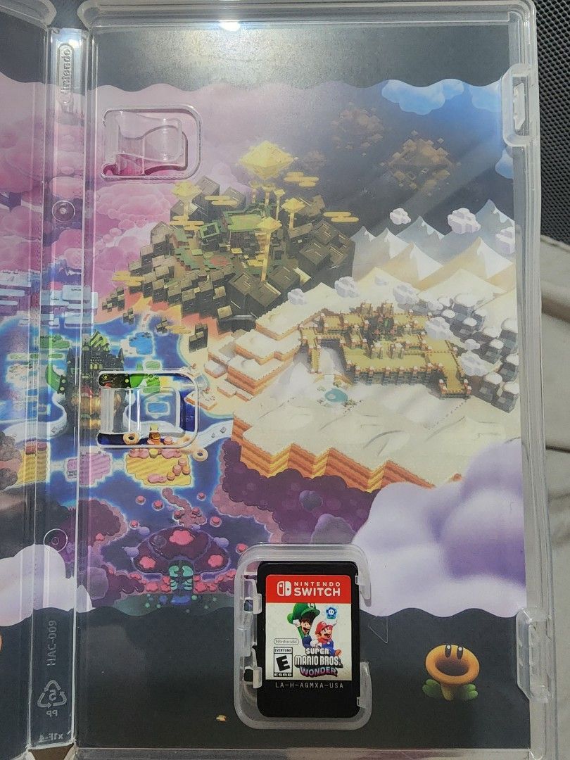 Super Mario Bros. Wonder Nintendo Switch Game (Category: Nintendo) located in Caloocan City. Submitted by erreiv (Listing ID 1452103330, Image 2). Description: - Super Mario Bros. Wonder for Nintendo Switch - Play as Mario, Luigi, Peach, and Daisy - Explore exciting new worlds - Collect Wonder Flowers for surprising transformations - Utilize new power-ups and abilities - Fun for the whole family.