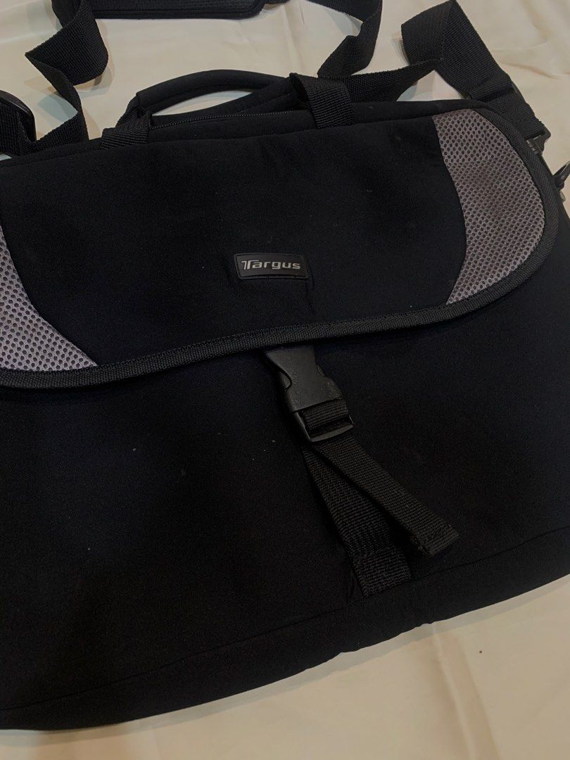 Targus Black Laptop Bag with Shoulder Strap (Category: Laptop Bags & Sleeves) located in Manila. Submitted by gracefilledshop (Listing ID 1452027951, Image 2). Description: - Brand: Targus - Color: Black - Carrying Options: Shoulder strap and top handles - Organization: Multiple interior compartments - Closure: Buckle on front flap - Ideal for: Carrying your laptop and daily essentials.