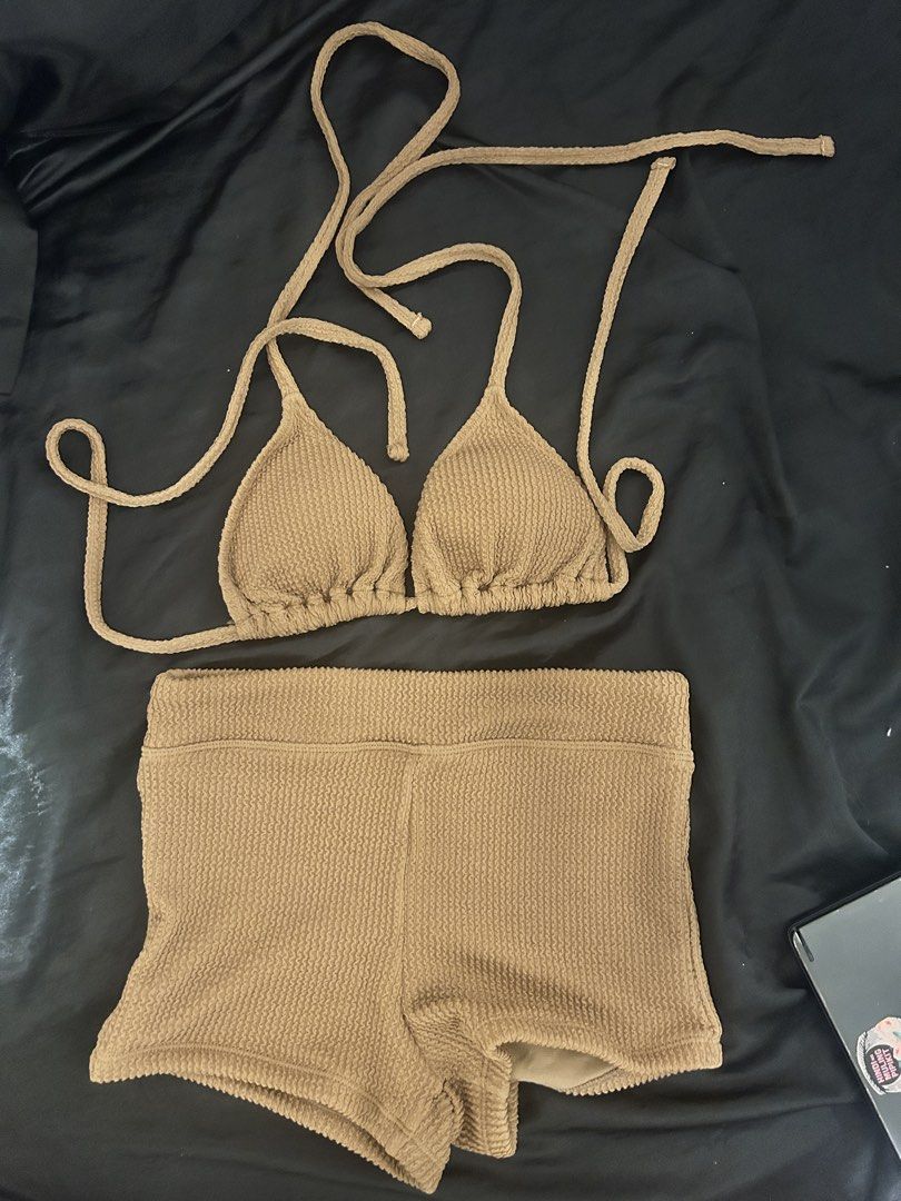 Textured Triangle Bikini Set - Tan (Category: Bikinis & Swimsuits) located in Manila. Submitted by declutteringmpc (Listing ID 1451901806, Image 1). Description: - Tan textured bikini set - Triangle top with adjustable tie straps - Matching high-waisted shorts - Ideal for beach or pool - Comfortable and stylish design - Perfect for your next vacation.