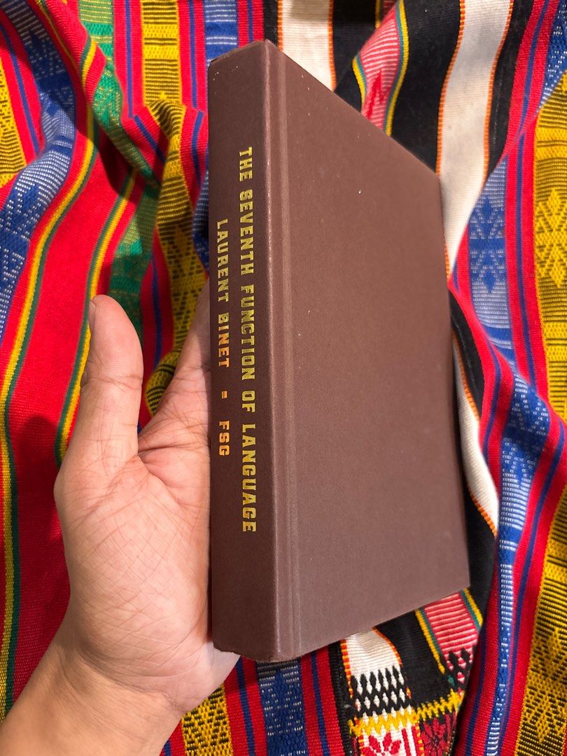 The Seventh Function of Language by Laurent Binet Novel (Category: Storybooks) located in La Trinidad. Submitted by alifiooo (Listing ID 1451984210, Image 2). Description: - Title: The Seventh Function of Language - Author: Laurent Binet - Translator: Sam Taylor - Genre: Literary Fiction - Features: Bright yellow cover with axe graphic, clear title and author print - Recommended for: Fans of literary fiction.