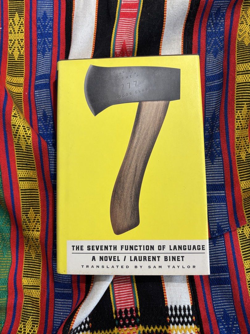 The Seventh Function of Language by Laurent Binet Novel (Category: Storybooks) located in La Trinidad. Submitted by alifiooo (Listing ID 1451984210, Image 1). Description: - Title: The Seventh Function of Language - Author: Laurent Binet - Translator: Sam Taylor - Genre: Literary Fiction - Features: Bright yellow cover with axe graphic, clear title and author print - Recommended for: Fans of literary fiction.