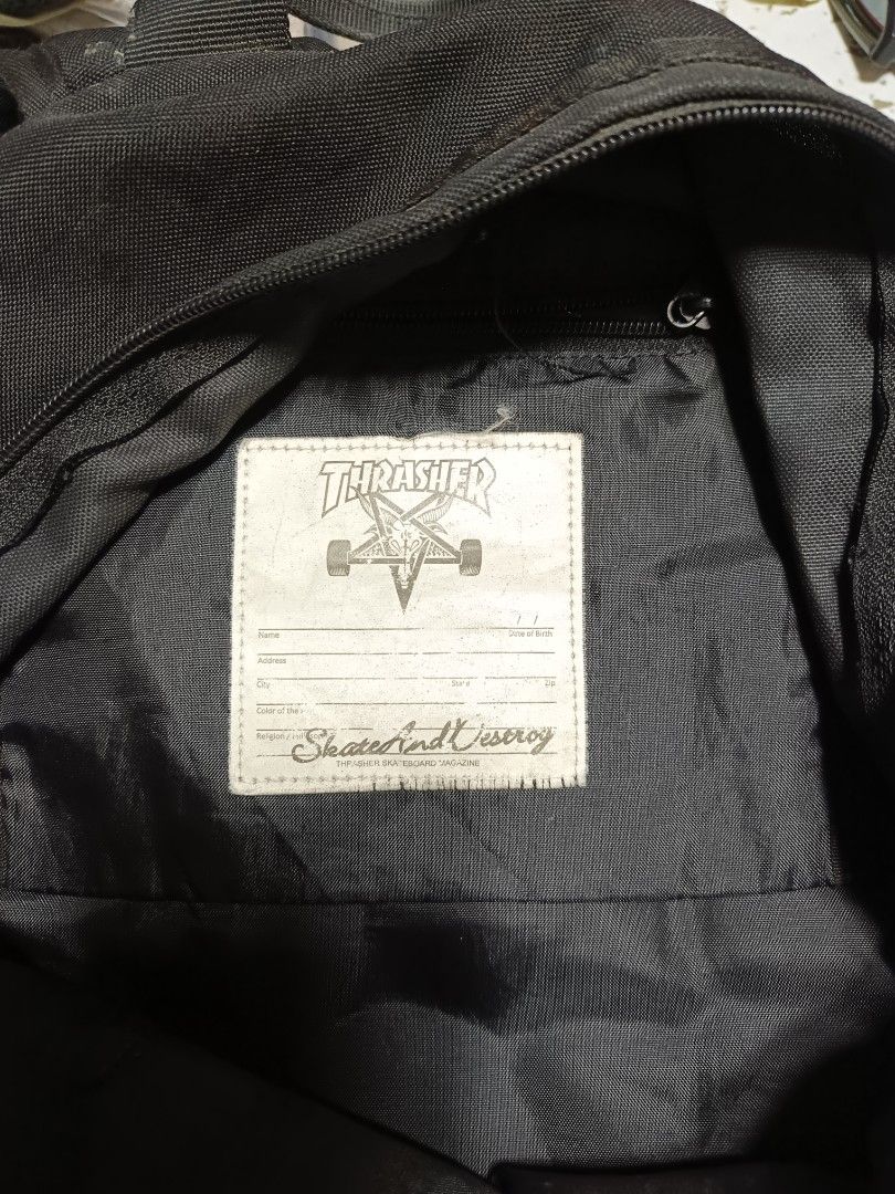 Thrasher Magazine Mesh pocket Skate Backpack Black (Category: Backpacks) located in Butuan. Submitted by sinaliky (Listing ID 1452050135, Image 2). Description: - Classic Black Thrasher backpack - Features iconic Thrasher logo on the front - Multiple pockets and compartments for ample storage - Adjustable straps for a comfortable fit - Perfect for school, travel, or everyday use - Shows some signs of wear, but remains in good, functional conditio