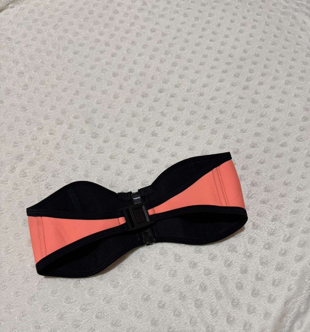 TRIANGL Coral Neoprene Strapless Bikini Top (Category: Bikinis & Swimsuits) located in Calamba. Submitted by iam.hides (Listing ID 1451917491, Image 3). Description: - Coral neoprene bikini top - Black trim detail - Front zipper closure - Adjustable strap at the back - Ideal for swimming and lounging - Comfortable and stylish design.