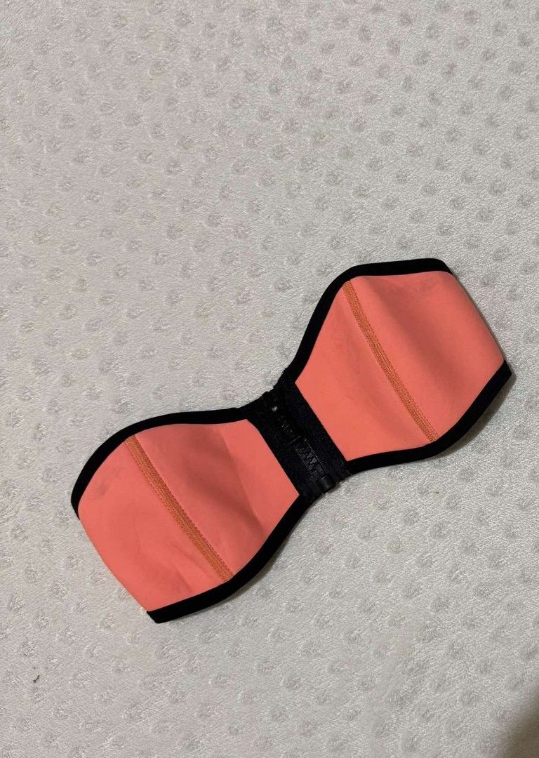 TRIANGL Coral Neoprene Strapless Bikini Top (Category: Bikinis & Swimsuits) located in Calamba. Submitted by iam.hides (Listing ID 1451917491, Image 1). Description: - Coral neoprene bikini top - Black trim detail - Front zipper closure - Adjustable strap at the back - Ideal for swimming and lounging - Comfortable and stylish design.