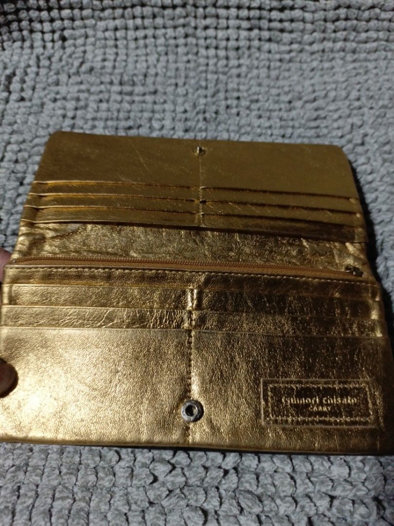 TSUMORI CHISATO Gold Leather Wallet (Category: Wallets & Card holders) located in Subic. Submitted by addiestrend (Listing ID 1452090687, Image 2). Description: - Chic gold leather wallet - Fun polka dot lining - Ample card slots for organization - Secure zip pocket for essentials - Easy snap closure - Some minor exterior signs of wear - Interior is clean and well-maintained - Ideal for everyday wallet FREE with any purchase from my listing.