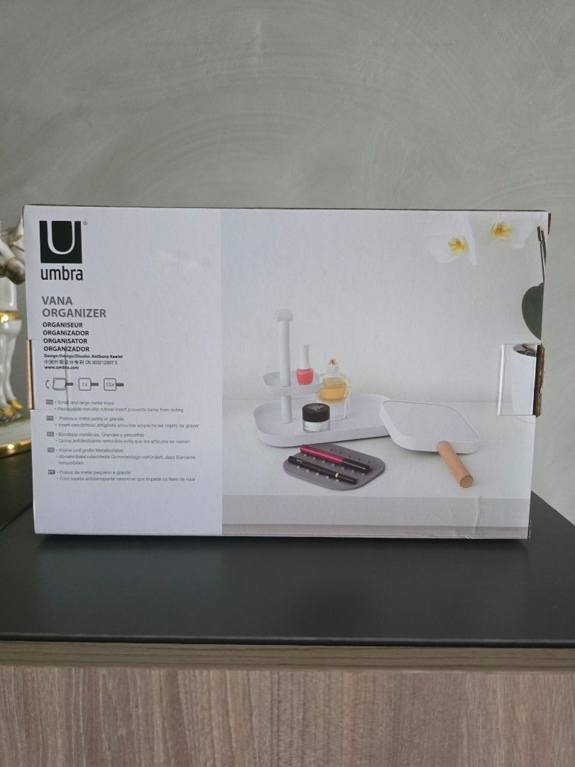 Umbra Vana Makeup Organizer with Mirror (Category: Makeup) located in Manila. Submitted by tch_86 (Listing ID 1451912260, Image 2). Description: Umbra Vana organizer - Ideal for makeup and small accessories - Double sided 1x/10x magnifying mirror with stamped metal trays and beechwood handle -Glass 1x/10x magnifying mirror - Compartments for brushes and products - Helps keep your vanity tidy - Dimensions: 7"l x 11"w x 11.5"h - Stylish white and w