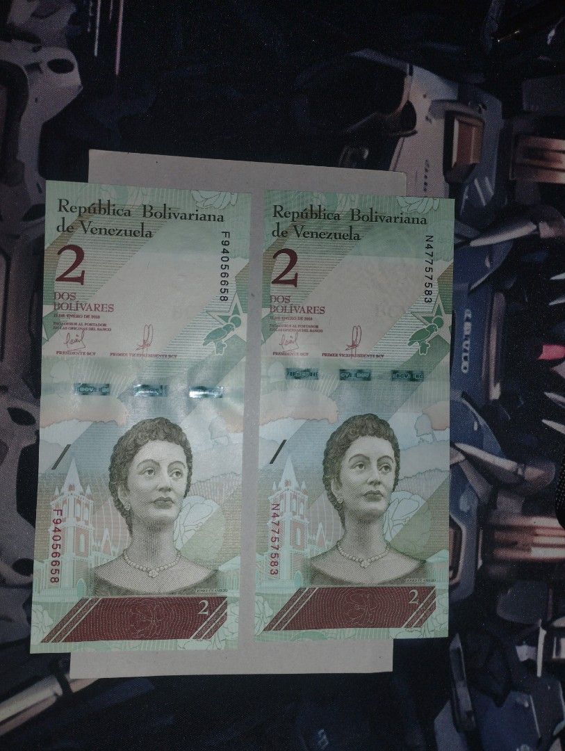 Venezuela - 2 Bolivares (Category: Currency) located in Baguio. Submitted by maximum_carnage (Listing ID 1451940396, Image 1). Description: - Two (2) 2 Bolivarianos banknotes from Venezuela. - Features portraits of women on one side and birds on the other. - Both notes are uncirculated. - Serial numbers: F9405658 and N47757583. - Perfect addition for any banknote collector..