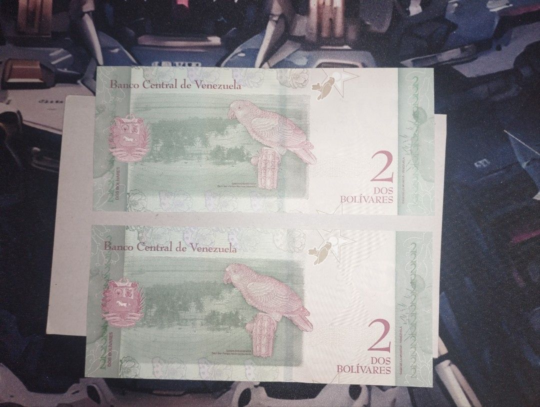 Venezuela - 2 Bolivares (Category: Currency) located in Baguio. Submitted by maximum_carnage (Listing ID 1451940396, Image 2). Description: - Two (2) 2 Bolivarianos banknotes from Venezuela. - Features portraits of women on one side and birds on the other. - Both notes are uncirculated. - Serial numbers: F9405658 and N47757583. - Perfect addition for any banknote collector..