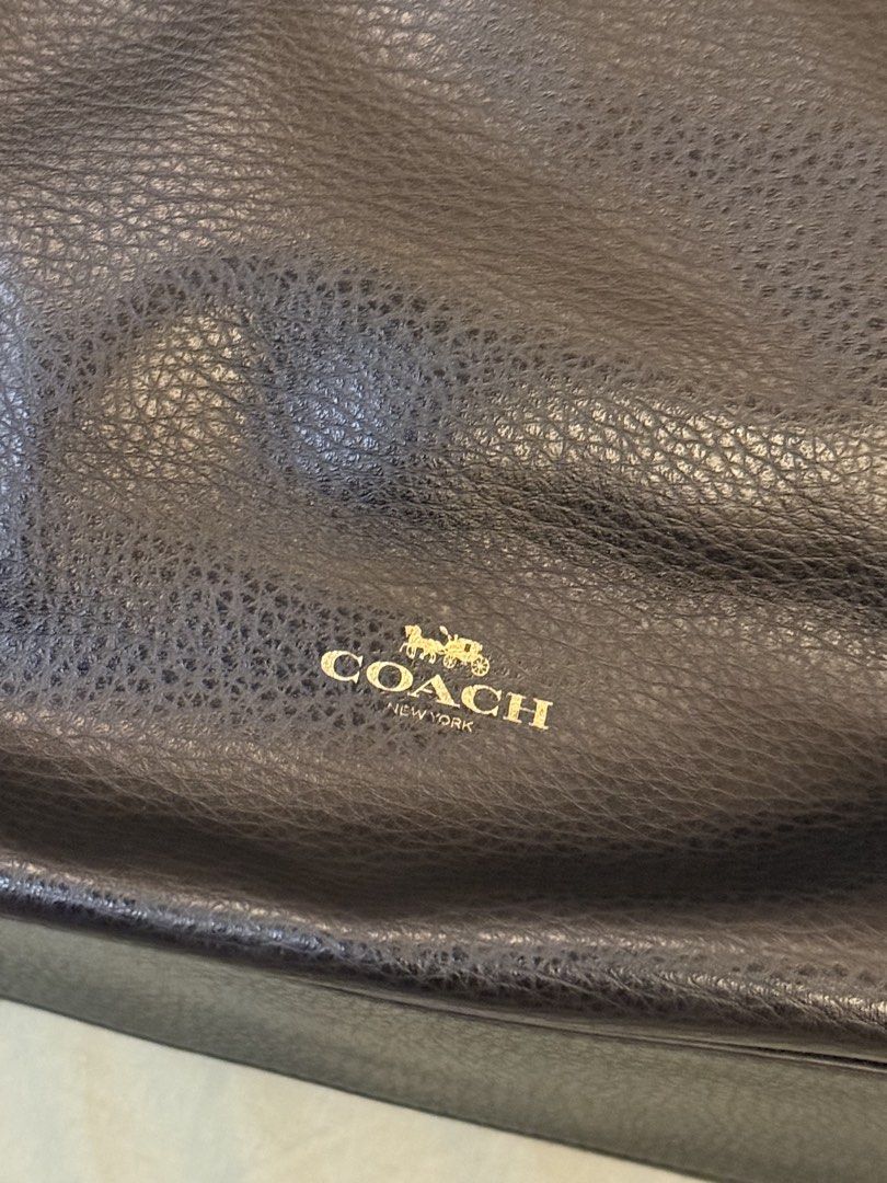 Vintage Coach Black Leather Tote Bag (Category: Luxury Bags & Wallets) located in Pasig City. Submitted by declutter1ng23 (Listing ID 1452039014, Image 2). Description: - Authentic Coach pebbled leather tote bag - Classic Coach logo on the front - Dangling gold Coach hangtag - Interior zippered pocket - Coach authenticity tag inside - Sturdy black straps - Perfect for work/school - Sourced from Japan - Price negotiable .