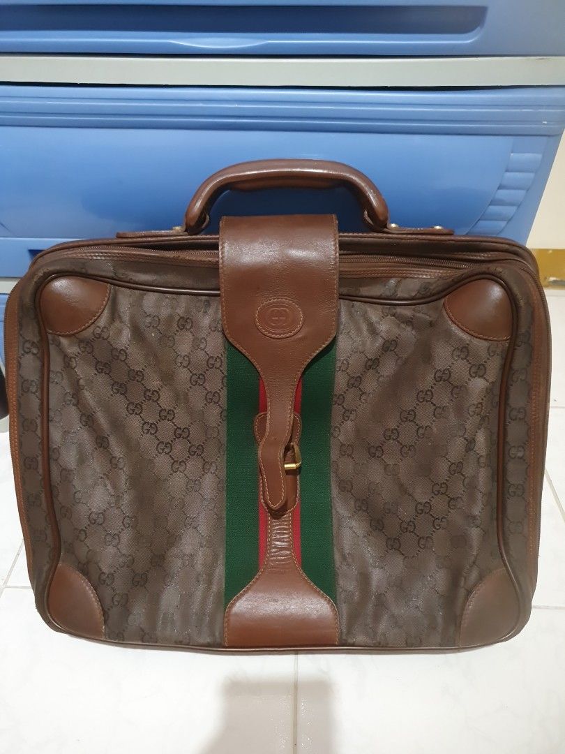 Vintage Gucci Monogram Briefcase (Category: Luxury Bags & Wallets) located in Quezon City. Submitted by montemayordarleen (Listing ID 1451969481, Image 3). Description: - Classic Gucci monogram briefcase - Color: Brown GG canvas with leather trim - Iconic green and red stripe detail - Spacious and lined interior - Sturdy handle - Functional zippers - Ideal for work or travel.
