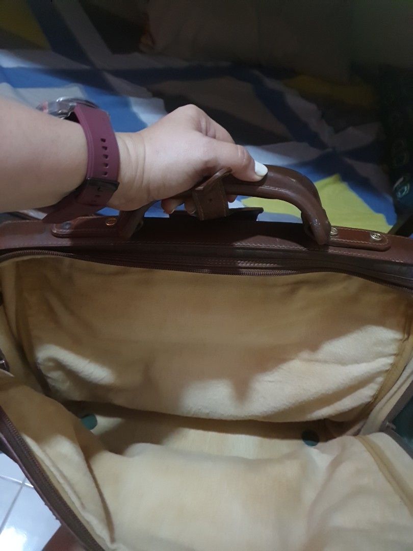 Vintage Gucci Monogram Briefcase (Category: Luxury Bags & Wallets) located in Quezon City. Submitted by montemayordarleen (Listing ID 1451969481, Image 2). Description: - Classic Gucci monogram briefcase - Color: Brown GG canvas with leather trim - Iconic green and red stripe detail - Spacious and lined interior - Sturdy handle - Functional zippers - Ideal for work or travel.