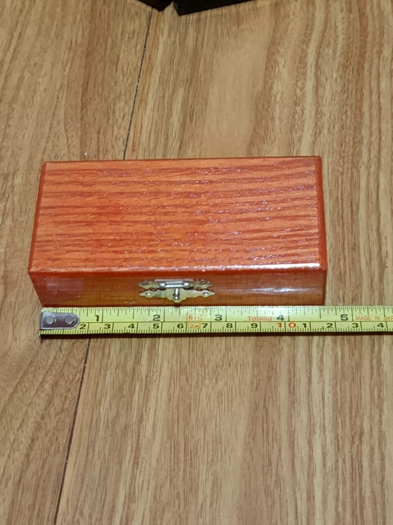 Vintage Wooden Storage Box with Clasp (Category: Storage Boxes & Baskets) located in Makati City. Submitted by nyxhemera26 (Listing ID 1452101957, Image 2). Description: Vintage Wooden Storage Box with Clasp - Interior features convenient wooden dividers. - Compact size: approximately 10cm in length. - Beautiful visible wood grain adds natural charm. - Perfect for storing small trinkets, jewelry, or keepsakes..