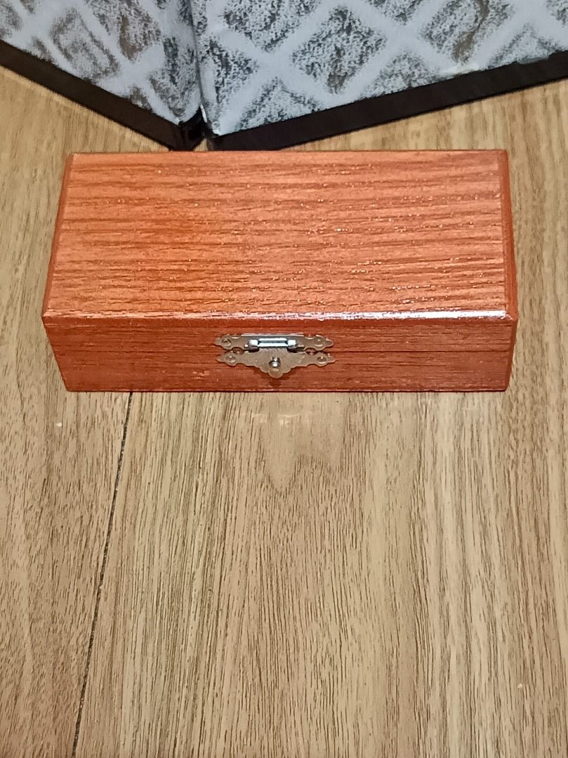Vintage Wooden Storage Box with Clasp (Category: Storage Boxes & Baskets) located in Makati City. Submitted by nyxhemera26 (Listing ID 1452101957, Image 1). Description: Vintage Wooden Storage Box with Clasp - Interior features convenient wooden dividers. - Compact size: approximately 10cm in length. - Beautiful visible wood grain adds natural charm. - Perfect for storing small trinkets, jewelry, or keepsakes..