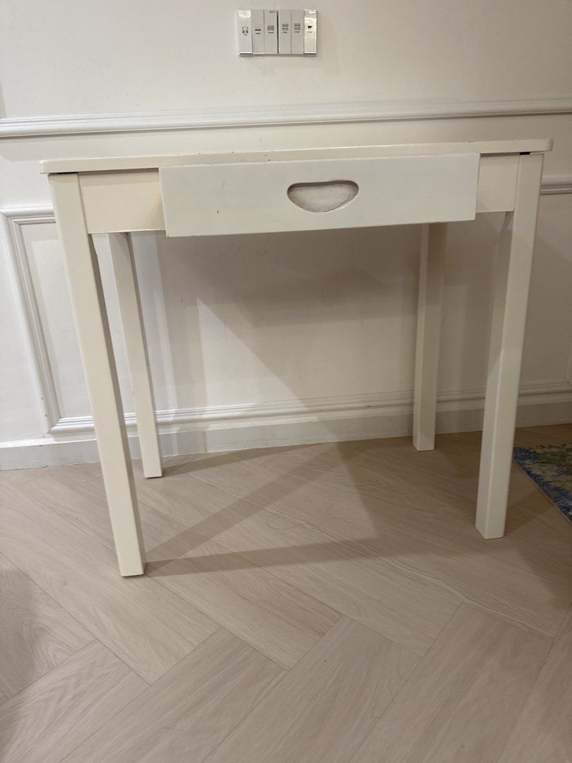 Computer table/Study table/White Table with Drawer (Category: Tables & Sets) located in Singapore. Submitted by szhou17 (Listing ID 1452075743, Image 3). Description: 80cm *45cm*75cm - Simple white console table - Features one drawer with cutout handlen - Sturdy, straight legs - Flat, clean top surface - Ideal for use as a side table or small desk - Versatile for any room.