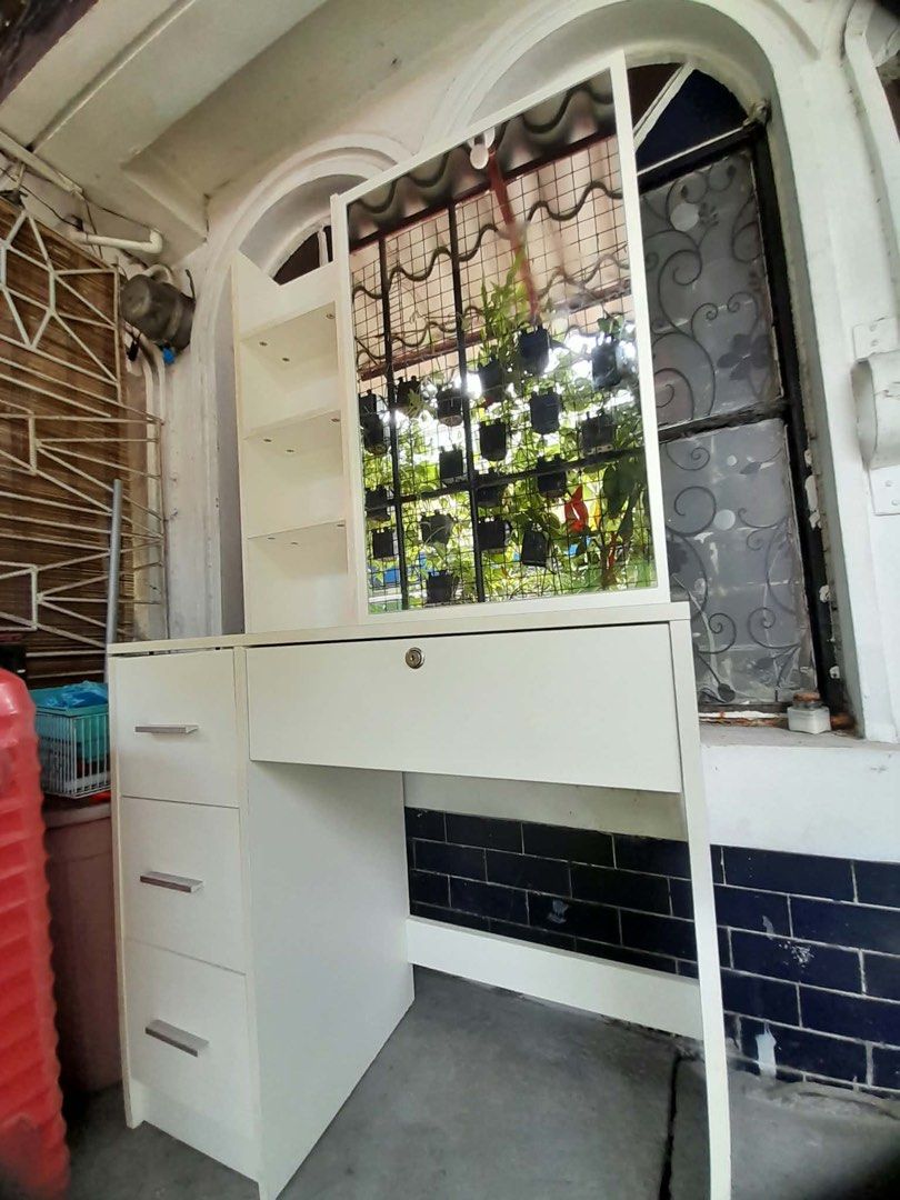 White Vanity Table with Mirror and Drawers (Category: Tables & Sets) located in Pasay City. Submitted by maxsell (Listing ID 1451916145, Image 1). Description: selling this from 3k to 2300 LP: 2000 Loc: Makati SIZE: 31 inch x 61 inch - White dressing table with a large mirror - Multiple shelves for storage - Top drawer with lock and key - NO CHAIR INCLUDED.