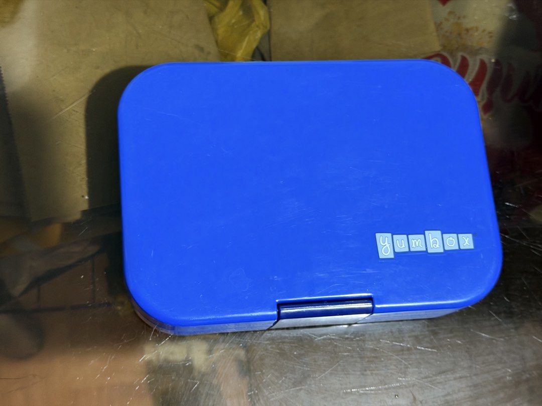 Yumbox Bento Box - Blue (Category: Food Organization & Storage) located in Manila. Submitted by alsellspreloves (Listing ID 1451934160, Image 1). Description: - Blue Yumbox bento box - Ideal for packing lunches - Features a secure latch - Minor scuffs from normal use - Ready for its next owner!.
