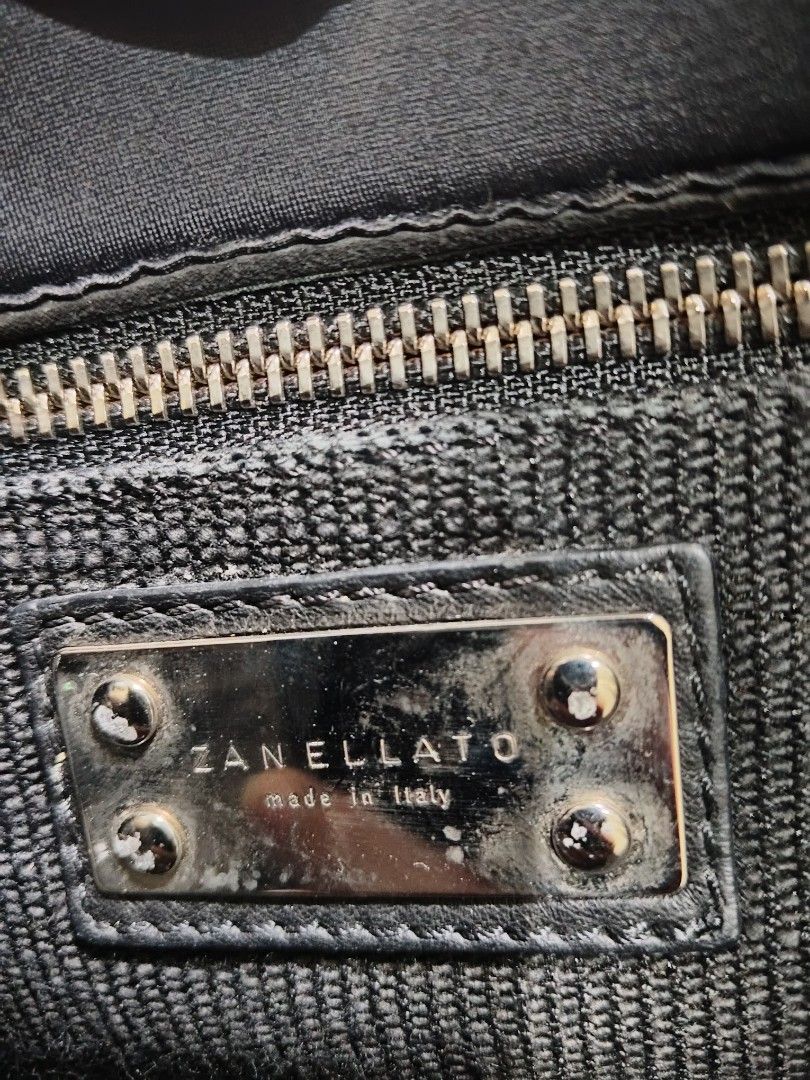 Zanellato Postina bag (Category: Luxury Bags & Wallets) located in Baguio. Submitted by is.titik_lux (Listing ID 1451937025, Image 2). Description: Brand: Zanellato Model: Postina (Tokyo Rimboccata style) Material: Nylon body with leather handle and trim Color: Black Features: Single top handle, detachable/adjustable shoulder strap, flap top with double turn-lock silver hardware closures..